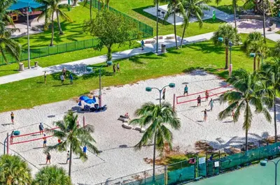 an aerial view of a park with a playground at StayCozy Apartments at The Grand in Miami