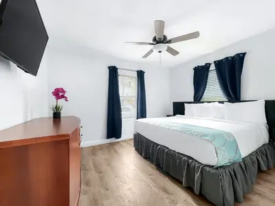a bedroom with a bed and a ceiling fan at The Swan in Hollywood