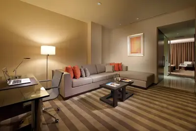 a living room with a couch and a table at EB Hotel Miami Airport in Miami