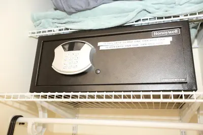 a open drawer with a watch in it on a shelf at Fantasy Island Inn, Caters to Men in Fort Lauderdale