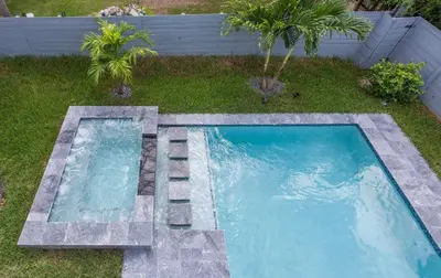a swimming pool in the middle of a yard at CASA HERMÈS Wilton Manor - Gay Guesthouse in Fort Lauderdale