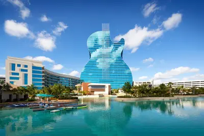 a view of a building with boats in the water at The Guitar Hotel at Seminole Hard Rock Hotel & Casino in Fort Lauderdale