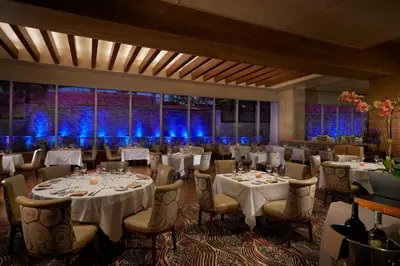 a banquet room with tables and chairs and blue lights at The Guitar Hotel at Seminole Hard Rock Hotel & Casino in Fort Lauderdale