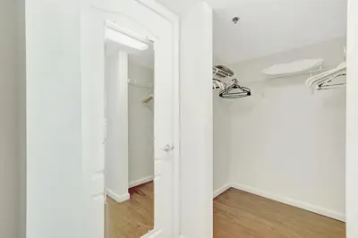 a hallway with white walls and a closet at Beautiful Apartments in Miami Brickell in Miami