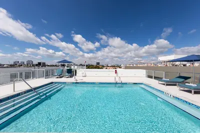 a swimming pool on the roof of a building at Penguin Hotel in Miami Beach