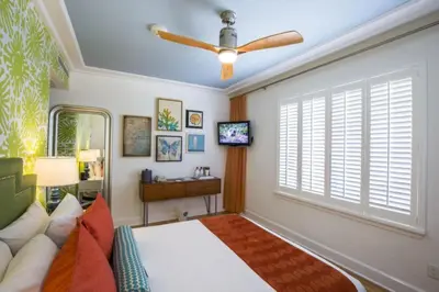 a bedroom with a bed and a ceiling fan at Circa 39 Miami Beach in Miami Beach