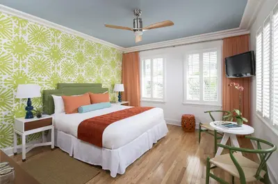 a bedroom with a large bed and a tv at Circa 39 Miami Beach in Miami Beach