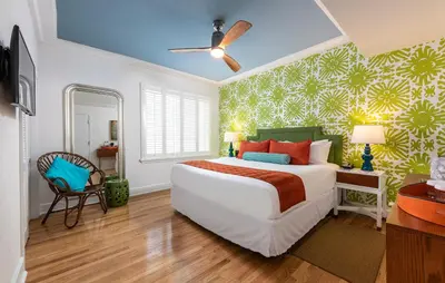 a bedroom with a large bed and a desk at Circa 39 Miami Beach in Miami Beach