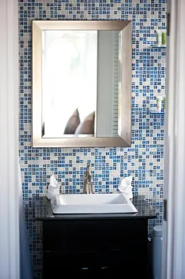 a bathroom with a sink and a mirror at Colony Hotel in Miami Beach