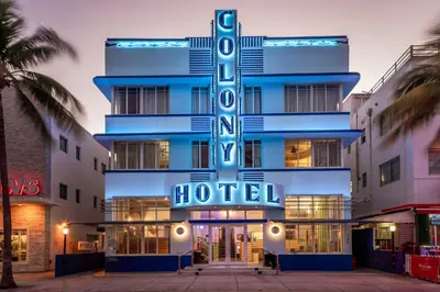 a hotel with a sign on the front of it at Colony Hotel in Miami Beach