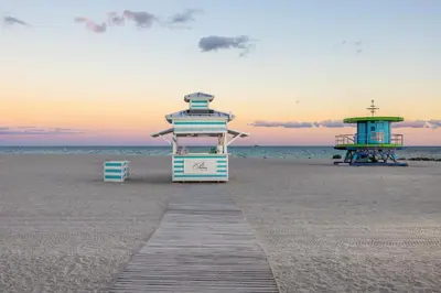 a boardwalk leading to a lifeguard station on the beach at The Palms Hotel & Spa in Miami Beach