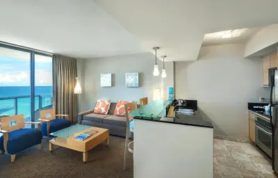 a living room with a couch and a table at Marenas Beach Resort in Miami Beach