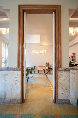 an open door into a room with a table and chairs at Century Hotel in Miami Beach