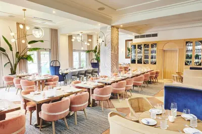 a dining room with tables and chairs at Park Central South Beach in Miami Beach