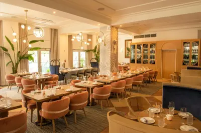 a dining room filled with tables and chairs at Park Central South Beach in Miami Beach