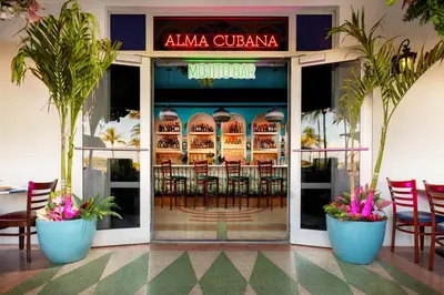 a restaurant with chairs in front of a building at Park Central South Beach in Miami Beach