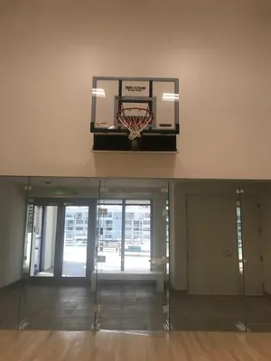an empty gym with a basketball hoop in a building at Hide House in Hollywood