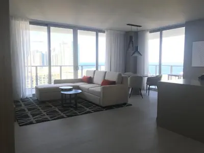 a living room with a couch and a table at Hide House in Hollywood