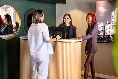 two women standing at a counter in a store at Beacon South Beach Hotel in Miami Beach