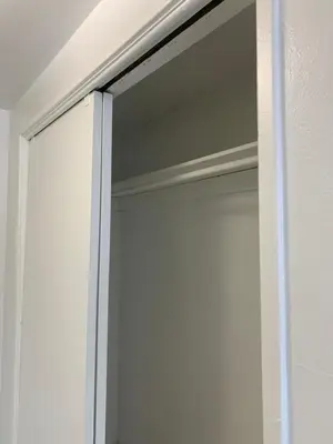 a sliding glass door of a white closet at International Inn on the Bay in Miami Beach