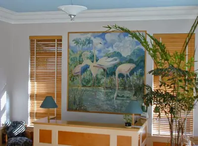 a painting of flamingos on the wall of a room at Viscay Hotel in Miami Beach