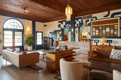 a living room with a couch and a table at Freehand Miami in Miami Beach