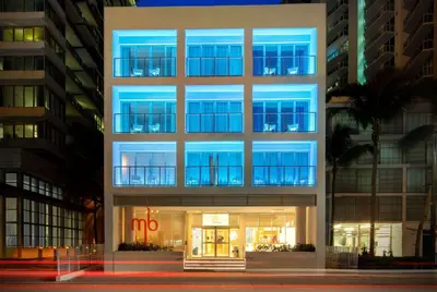 a tall building with blue lights in front of it at MB Hotel, Trademark Collection by Wyndham in Miami Beach