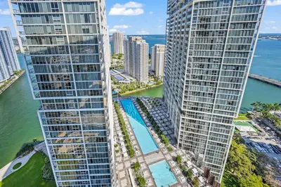 an aerial view of two tall buildings next to the ocean at Luxury 1 BR Condo W Icon Brickell-Waterviews in Miami