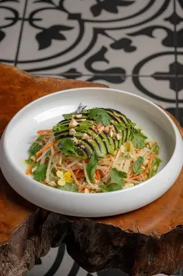 a white bowl of food on a table at Casa Faena Miami Beach in Miami Beach