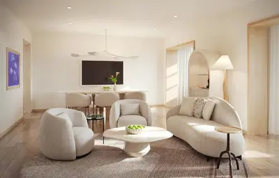 a living room with a couch and chairs and a table at Delano Miami Beach in Miami Beach