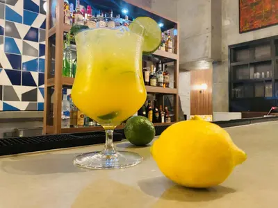a drink on a bar with a lemon on the counter at Hotel Indigo Miami Brickell by IHG in Miami