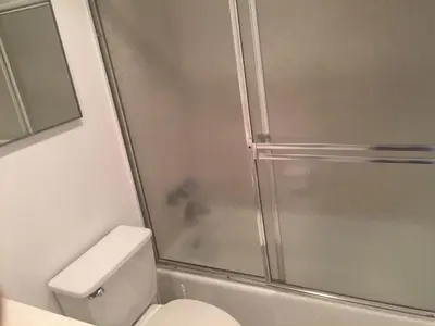 a bathroom with a shower and a white toilet at Tides Beachfront Resort - 2 Bedroom Direct Oceanview Condo in Hollywood