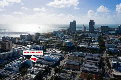 a city with a sign that says you are here at Miami Beach Rooms B&B in Miami Beach