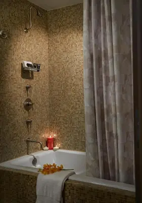 a bathroom with a bath tub with a candle at Seminole Hard Rock Hotel & Casino Hollywood in Fort Lauderdale