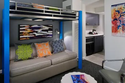 a living room with a couch and a bunk bed at Hotel Colonnade Coral Gables, Autograph Collection in Miami