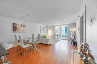 a living room with a dining table and a couch at Fabulous apartment in Brickell in Miami