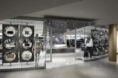 a display case in a clothing store with a woman in it at Fontainebleau Miami Beach in Miami Beach