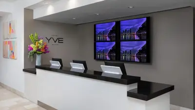 a waiting room with a row of chairs at YVE Hotel Miami in Miami