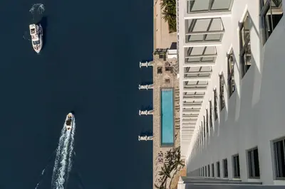 a boat in the water next to a building at Hyde Beach House in Hollywood