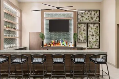 a bar with chairs and a flat screen tv at Hyde Beach House in Hollywood