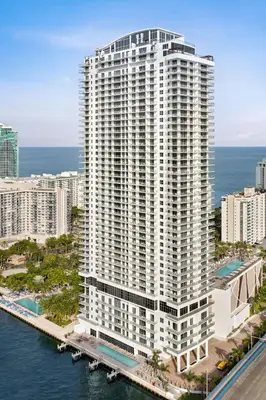 an aerial view of a large white building next to the water at Hyde Beach House in Hollywood