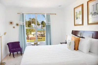 a bedroom with a large bed and a window at Beach Park Hotel in Miami Beach