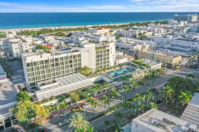 an aerial view of a city with palm trees and the ocean at Hotel Chelsea in Miami Beach