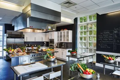 a large kitchen with a chalkboard on the wall at Biltmore Hotel Miami Coral Gables in Miami