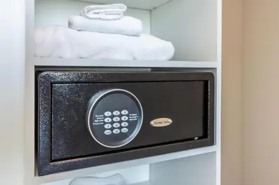 a microwave in a refrigerator with towels in it at Amazing Apartments at H Beach House in Hollywood