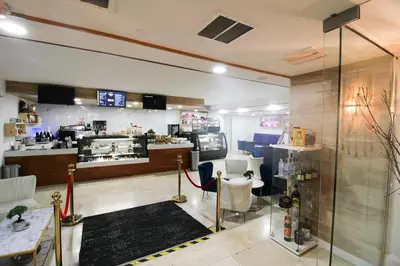 a salon with chairs and a counter in a room at Alexander 511 Beachfront condo with 2 pools, direct beach access, sauna, tikki bar in Miami Beach