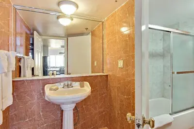 a bathroom with a sink and a shower at Castle Th14 in Miami Beach