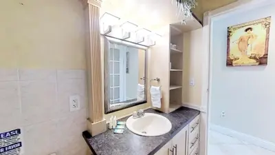 a bathroom with a sink and a mirror at Castle B17 Contemporary Condo with Pool, Beach Access and Free Parking in Miami Beach