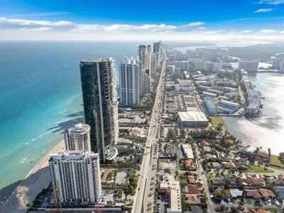 an aerial view of a city and the ocean at Steps to the Sand Beachfront Escape- 25th Floor Views in Miami Beach