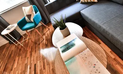a living room with a couch and a table at Broadwaysuites Downtown By RocketStay in Miami